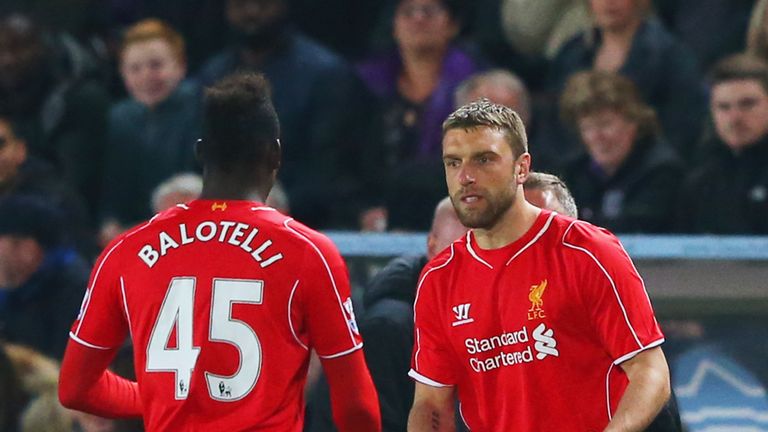 HULL, ENGLAND - APRIL 28:  Mario Balotelli of Liverpool shakes hands with Rickie Lambert as he is substituted during the Barclays Premier League