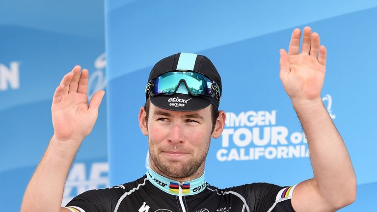 Mark Cavendish of Great Britain riding for Etixx - Quickstep reacts to his win of the points leader green jersey after stage three 