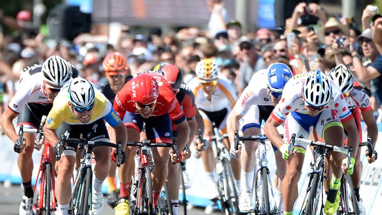 Mark Cavendish of Great Britain wearing the yellow jersey riding for Etixx - Quickstep, sprints to the finish ahead of Wouter Wippert