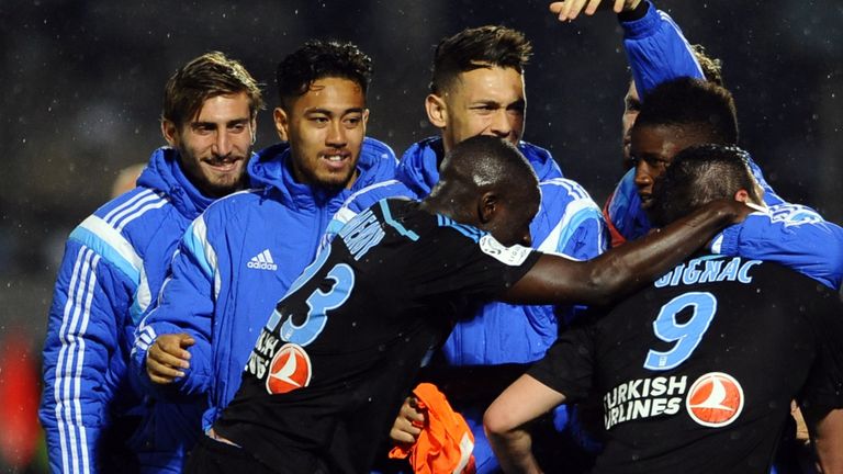 Marseille's players celebrate after scoring a goal during the French L1 football match between Metz and Marseille