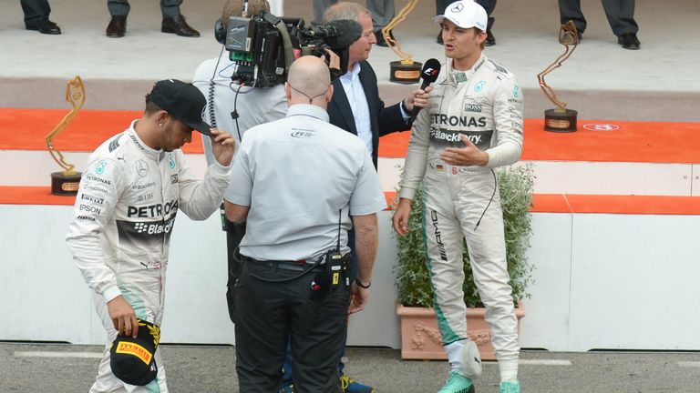 Martin Brundle interviews Nico Rosberg on the Monaco podium, as a disconsolate Lewis Hamiton gathers his thoughts