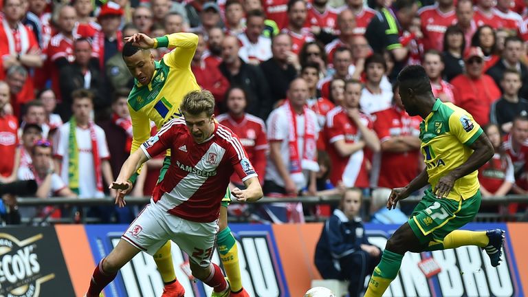 Norwich City's Martin Olsson brings down Middlesbrough's Patrick Bamford as Alexander Tettey looks on during the English Championship play off final