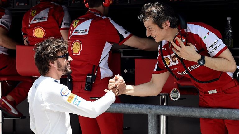 Fernando Alonso greets his former Ferrari colleague Massimo Rivola