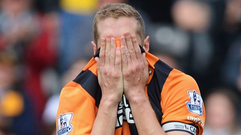 Michael Dawson of Hull City shows his dejection after being relegated from the Premier League 