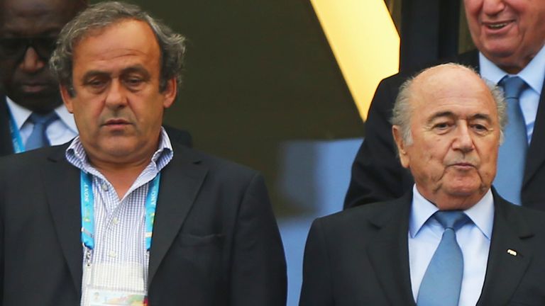 UEFA president Michel Platini (l) with his FIFA counterpart Sepp Blatter during last year's World Cup in Brazil