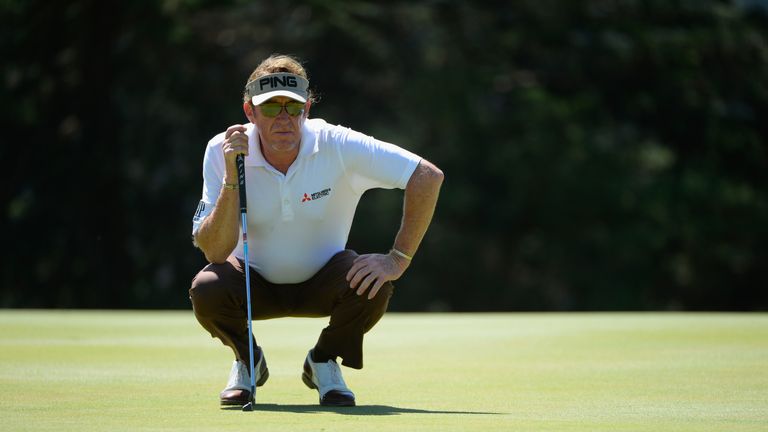 Miguel Angel Jimenez of Spain lines up his putt on the fourth green during round two of the World Golf Championship Cadillac