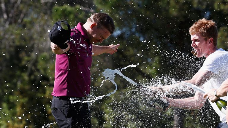 James Morrison is sprayed with champange by Andrew Dodt and David Horsey after winning the Open de Espana 