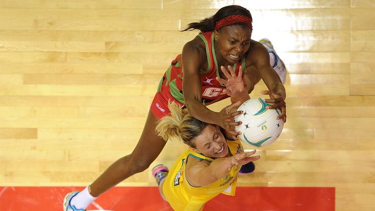  Laura Geitz of Australia competes for the ball with Nikjai Kumwenda of Malawi during the match between the Australian D