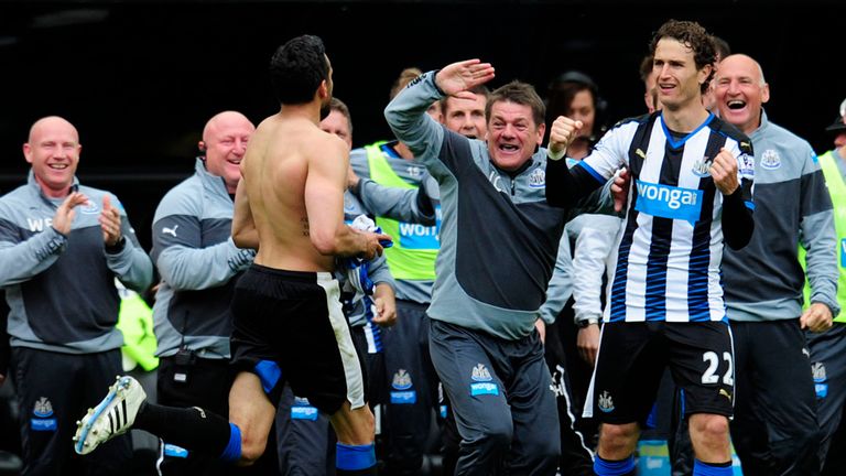 Newcastle's Jonas Gutierrez runs towards manager John Carver after scoring