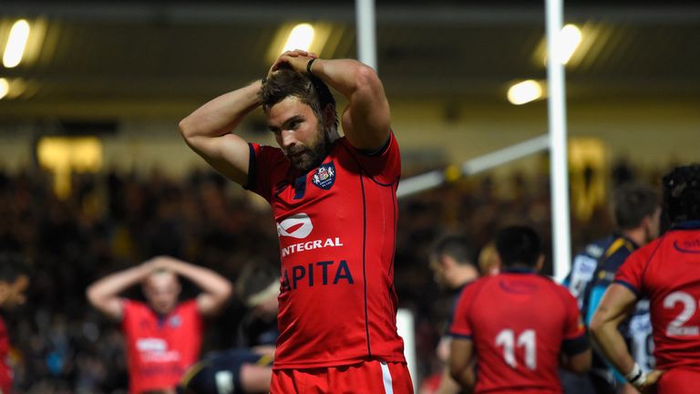 Bristol Flyhalf Nicky Robinson looks on dejectedly after Chris Pennell's try. 