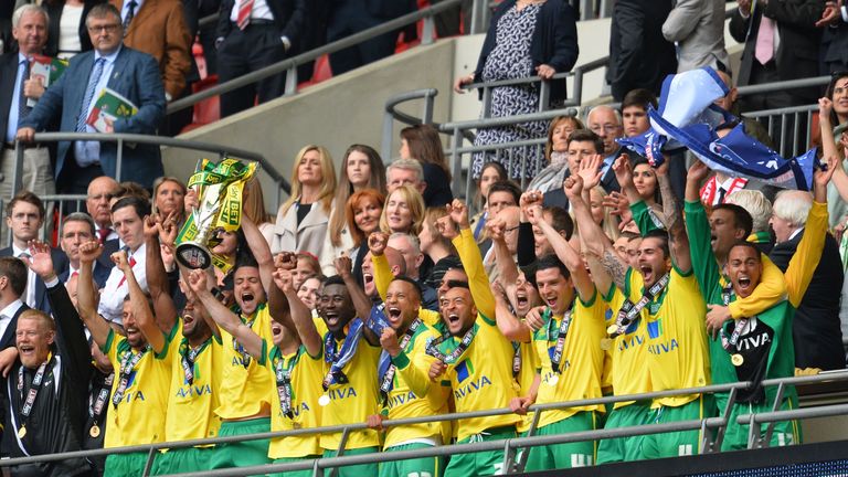 Russell Martin (4L) raises the trophy during the official presentation after Norwich City won the English Championship play off final