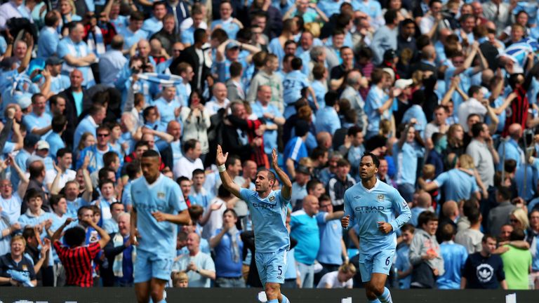 MANCHESTER, ENGLAND - MAY 13:  Pablo Zabaleta (C) of Manchester City celebrates after scoring the opening goal during the Barclays Premier League match bet