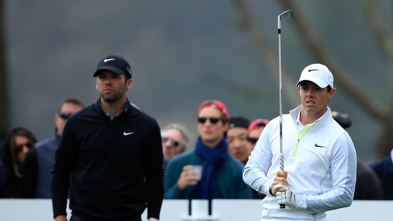 Paul Casey of England and Rory McIlroy of Northern Ireland stand on the second hole tee box 