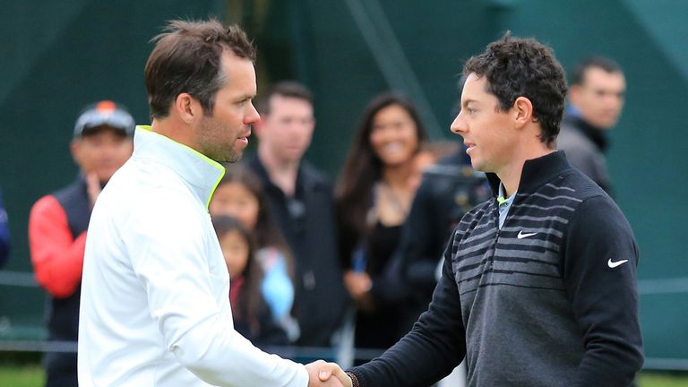 SAN FRANCISCO, CA - MAY 03:  (R-L) Rory McIlroy of Northern Ireland shakes hands with Paul Casey of England after winning their quarter final match the Wor