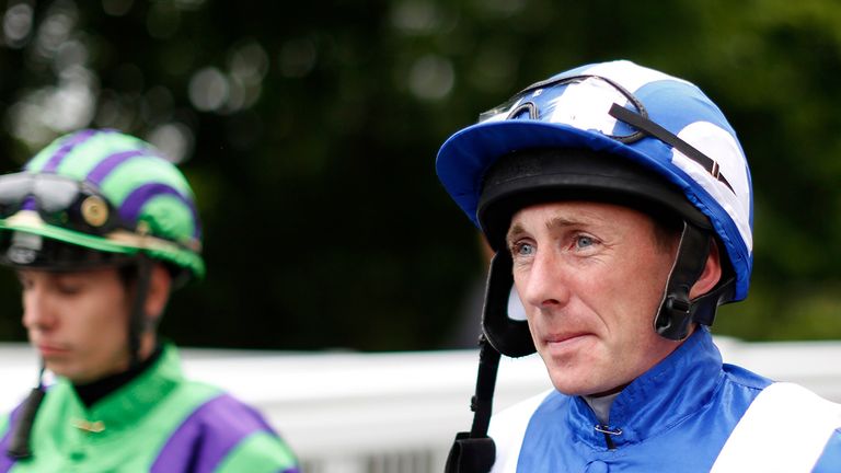 Paul Hanagan makes his way to the parade ring