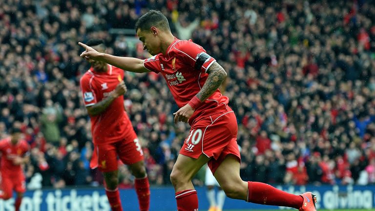 Philippe Coutinho celebrates his goal after putting Liverpool 1-0 up against QPR