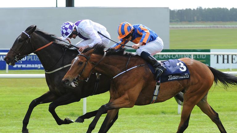 Pleascach ridden by Kevin Manning (left) win the Tattersalls Irish 1,000 Guineas from Found and Ryan Moore.