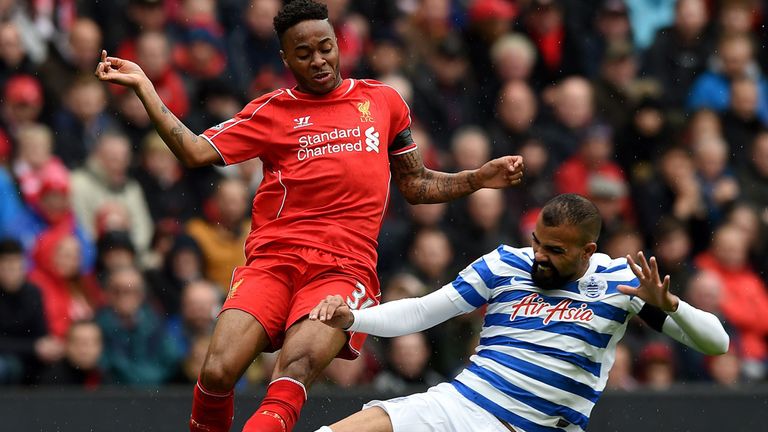 Liverpool winger Raheem Sterling is tackled by QPR's Sandro at Anfield