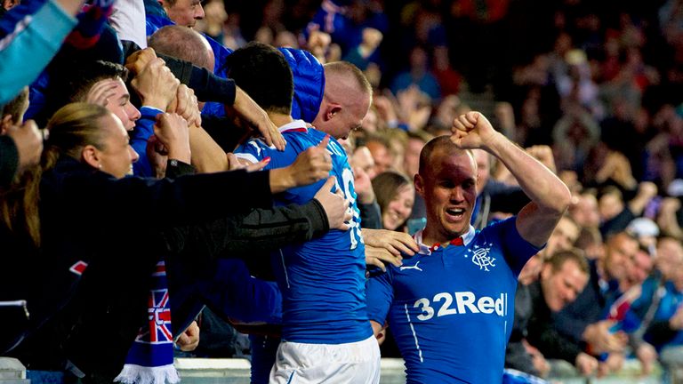 Rangers fans celebrate with goalscorer Kenny Miller after he doubles his side's lead.