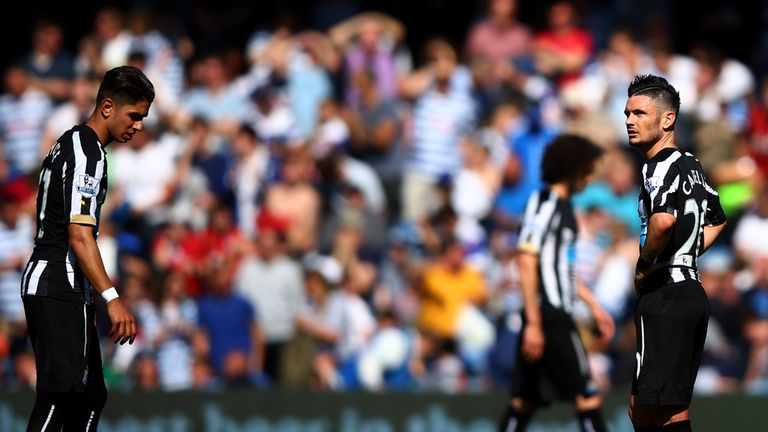 A dejected Remy Cabella of Newcastle (right) looks on after his side concede a second against QPR