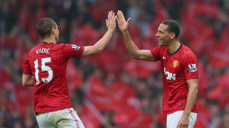 Rio Ferdinand of Manchester United celebrates scoring the winning goal against Swansea with team-mate Nemanja Vidic in May 2013