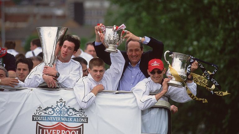 Robbie Fowler, Steven Gerrard, manager Gerard Houllier and Sami Hyypia display Liverpool's three trophies, the UEFA Cup, Worthington Cup and 