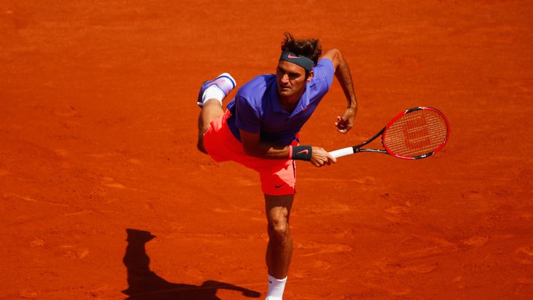 Roger Federer in action against Alejandro Falla of Colombia on day one of the 2015 French Open at Roland Garros