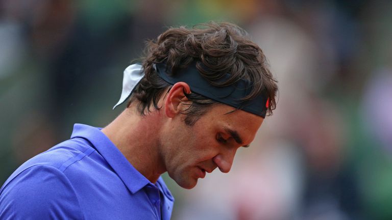 Roger Federer of Switzerland looks on in his Men's Singles match against Gael Monfils of France