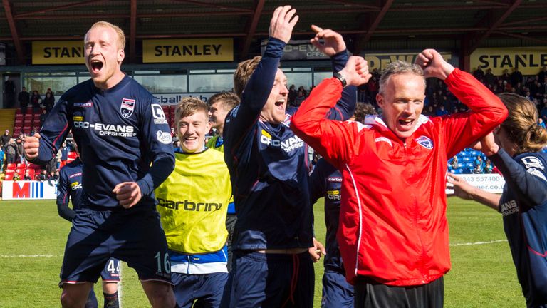 Ross County players and staff celebrate at full-time as they secure their place in the Scottish Premiership for next season