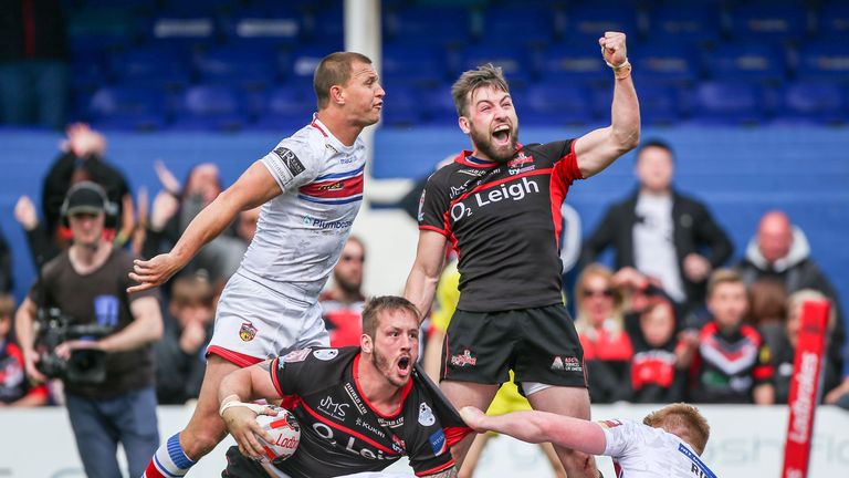 Leigh's Gregg McNally (top) celebrates Oliver Wilkes' try