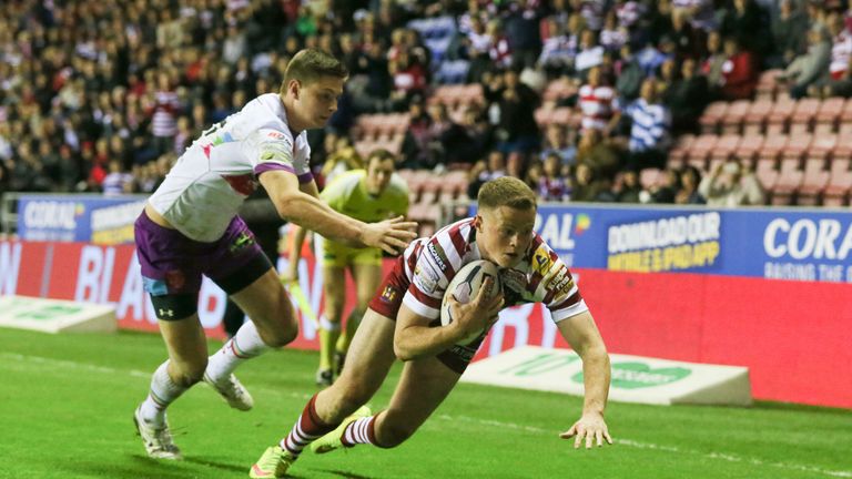 Wigan Warriors' George Williams completes his hat trick against Hull KR