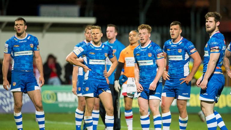 Wakefield Wildcats look on dejected as the points pile up against them against Hull KR