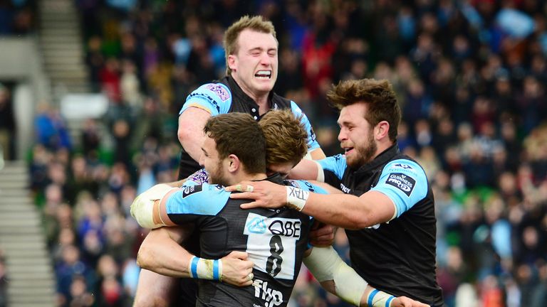 Richie Vernon is mobbed by his team-mates after scoring Glasgow's fourth try