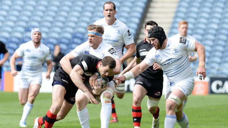 Edinburgh wing Tim Visser is tackled by Jamie Heaslip