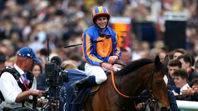NEWMARKET, ENGLAND - MAY 03: Ryan Moore celebrates after riding Legatissimo to win TheQipco 1000 Guineas Stakes at Newmarket racecourse on May 03, 2015 in 
