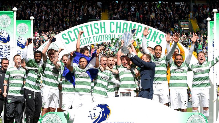 The Celtic players celebrate as they are presented with the Scottish Premiership trophy