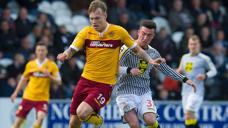 Action from Paisley where Motherwell's Lee Erwin (l) battles with St Mirren's Stephen Mallan