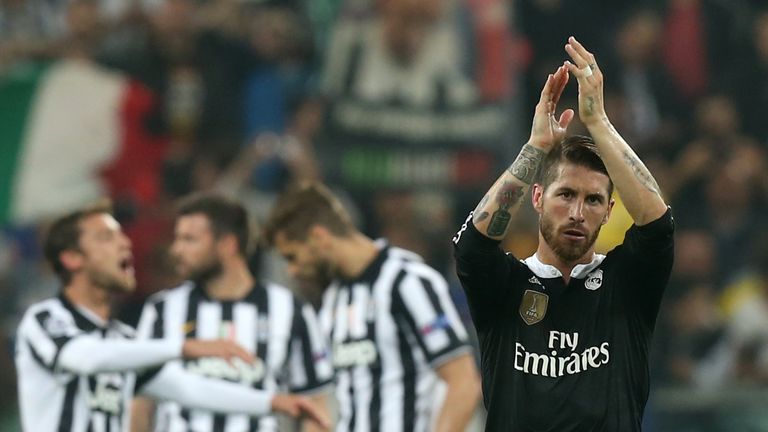 Real Madrid's defender Sergio Ramos (R) greets fans at the end of the UEFA Champions League semi-final first leg football match Juventus vs Real Madrid