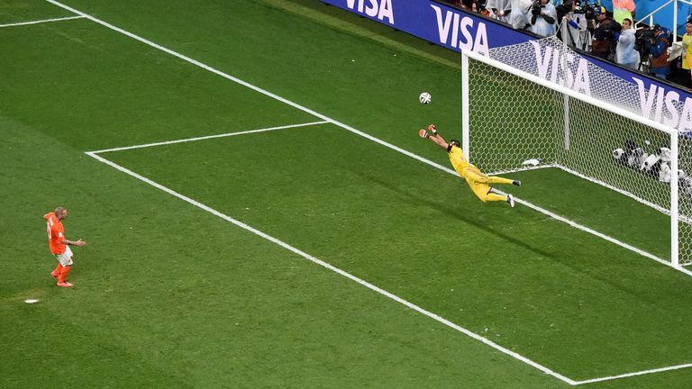 Argentina's goalkeeper Sergio Romero makes a save against Netherlands' Wesley Sneijder during penalty shootout of semi-final of the World Cup