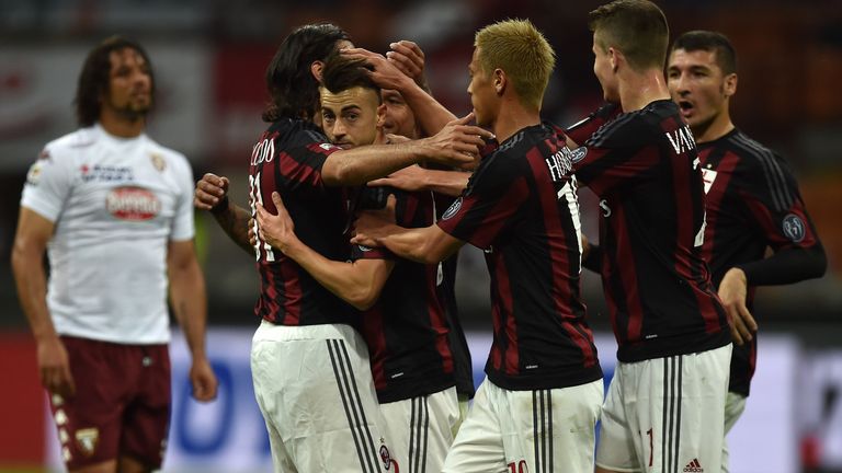 Stephan El Shaarawy (2nd L) of AC Milan celebrates the opening goal with team mates during the Serie A match between AC Milan and Torino
