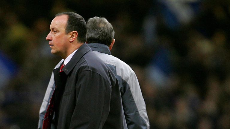 CARDIFF, United Kingdom:  Liverpool manager Rafael Benitez (L) walks past his team's captain Steven Gerrard after they lost to Chelsea in ther Carling Cup 