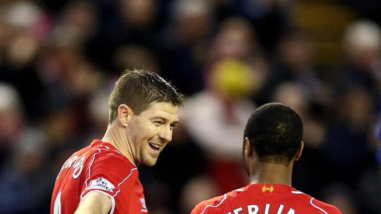 Steven Gerrard of Liverpool celebrates with teammate Raheem Sterling of Liverpool after scoring against Leicester