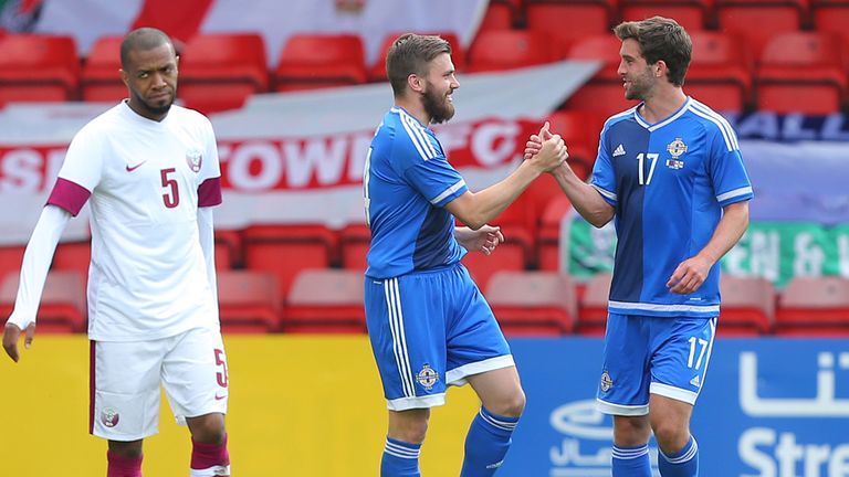 Stuart Dallas of Northern Ireland celebrates with team-mate Will Grigg after scoring