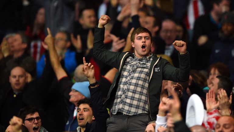 Sunderland fans celebrate on the final whistle as their team avoid relegation during the Barclays Premier League match between Arsenal and Sunderland
