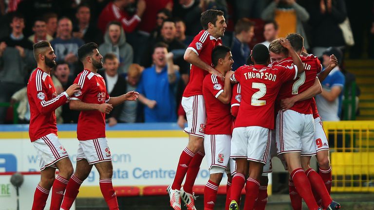 Swindon players celebrate during the win