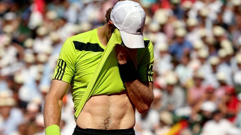 Andy Murray reacts during his men's singles match against Rafael Nadal on day thirteen of the French Open 2014