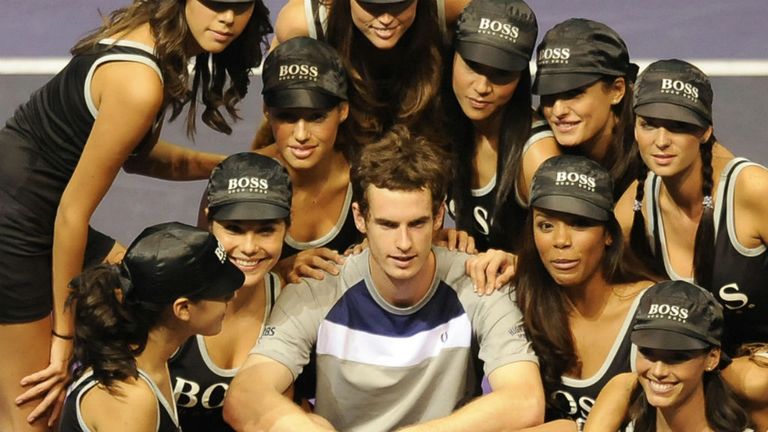 Andy Murray poses with ball girls after beating Gilles Simon in the final of the Madrid masters 2008