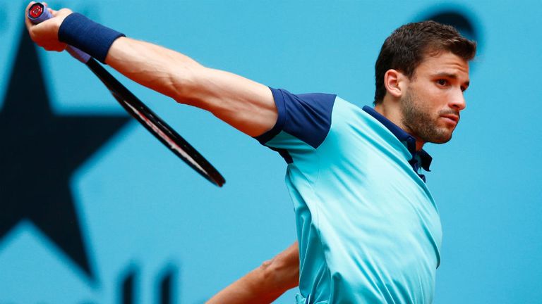 Grigor Dimitrov of Bulgaria in action against Donald Young of USA during day four of the Mutua Madrid Open