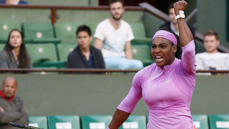 Serena Williams celebrates after winning her match against Belarus' Victoria Azarenka at the French Open 