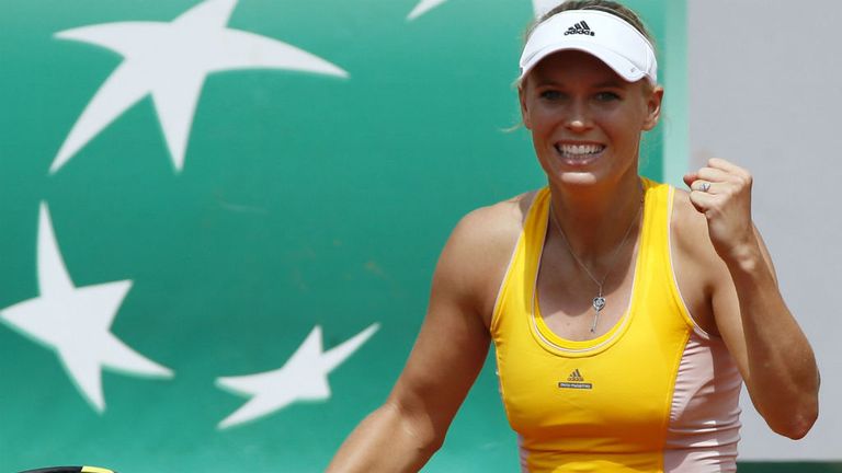 Caroline Wozniacki celebrates after defeating Karin Knapp during the women's first round at Roland Garros